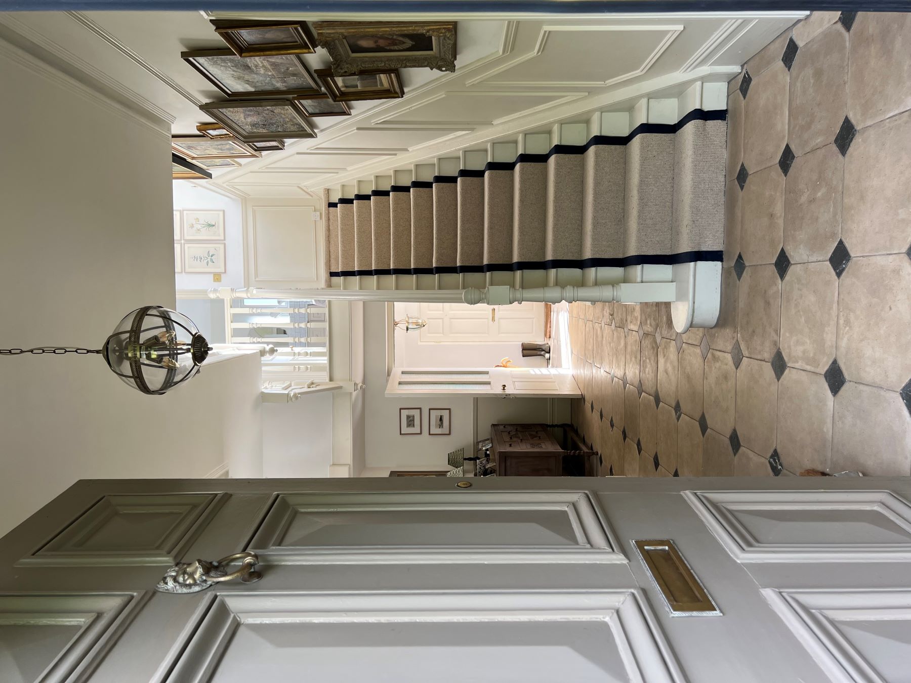 cream stair runner carpet in English country house hallway